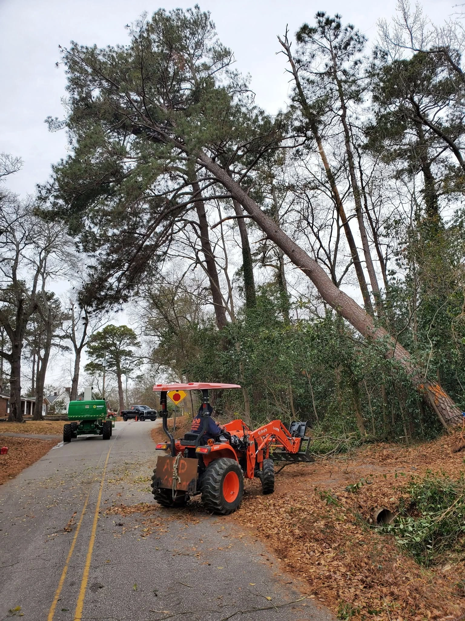 A&D kubota tractor leaning pine roadside cayce