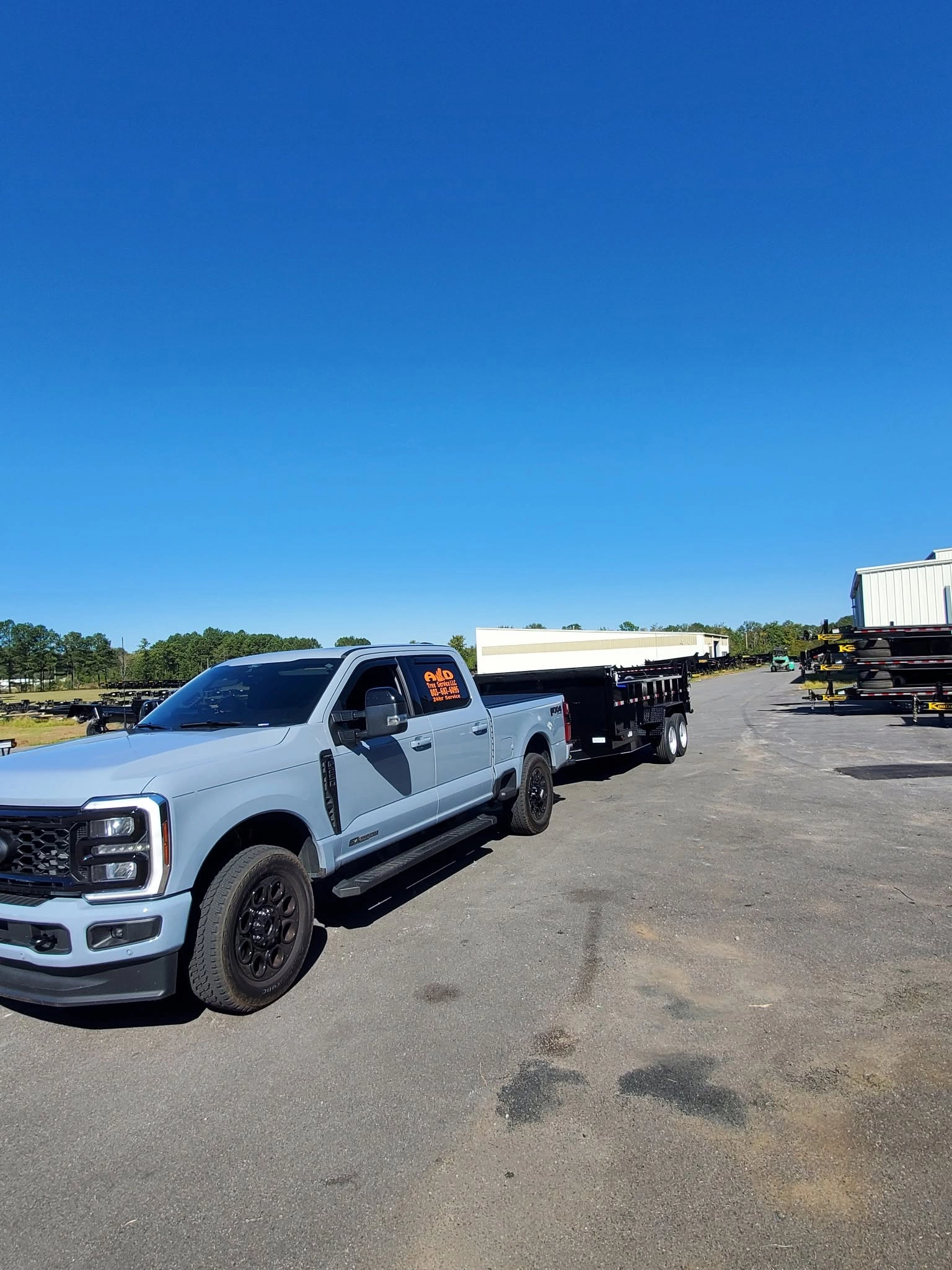 A&D tree service gray ford pickup black dump trailer dea