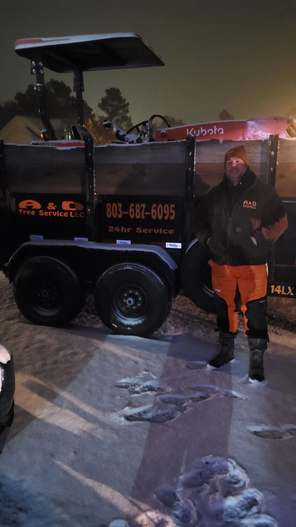 A&D worker snow night lettered dump trailer kubota cayce