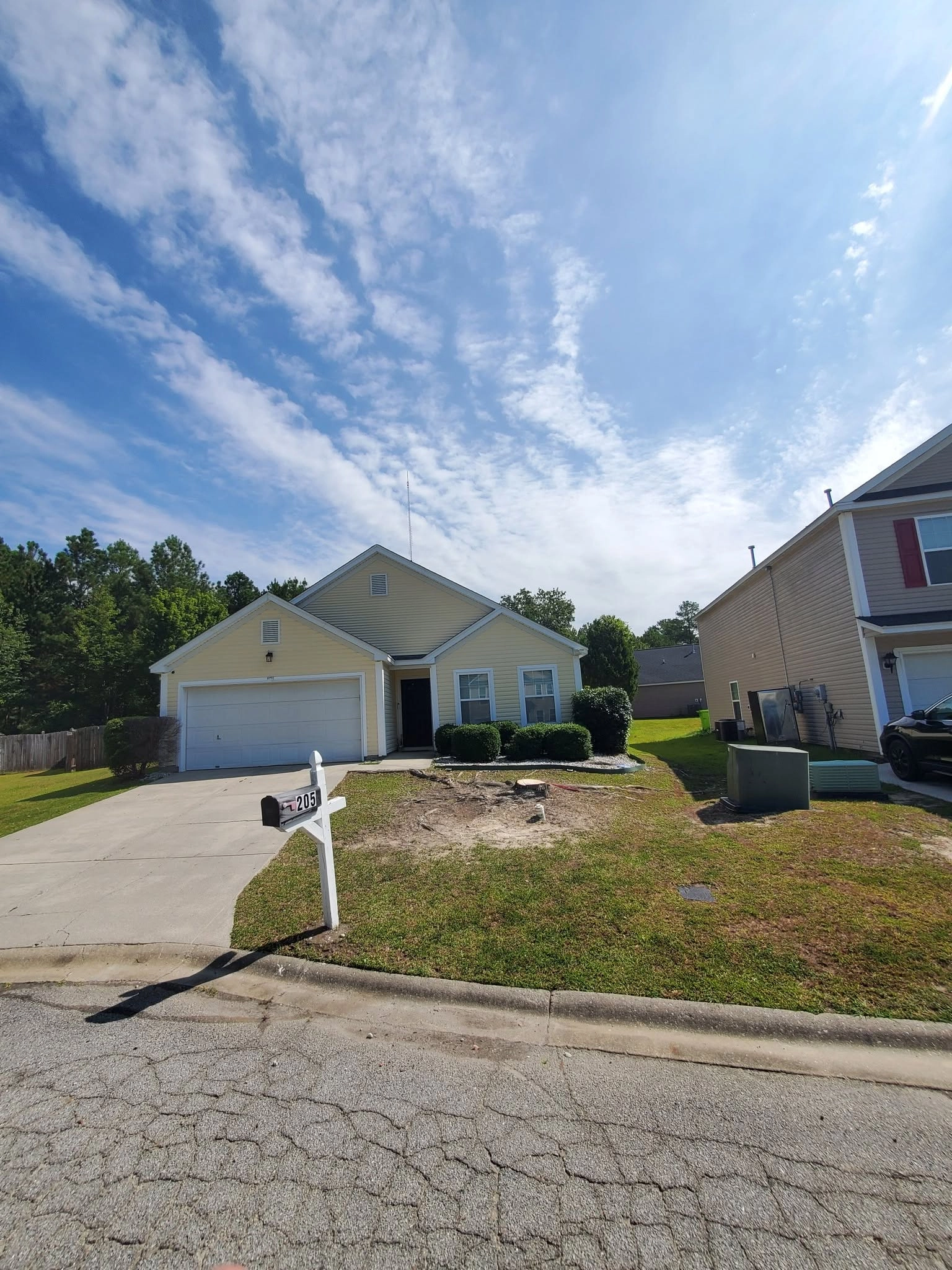 Front lawn stump grinding yellow ranch house cayce sc
