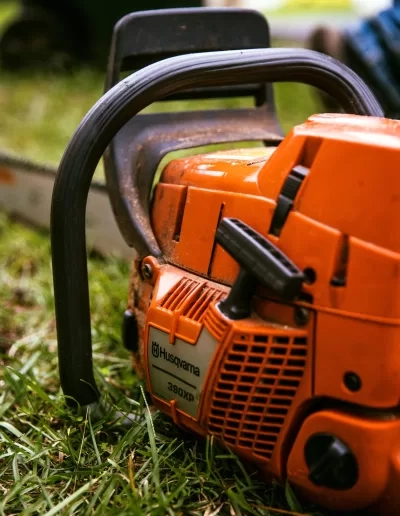 Husqvarna 390xp chainsaw grass close up cayce sc