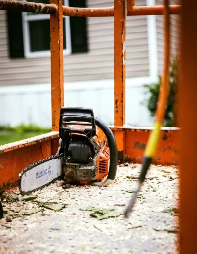 Husqvarna chainsaw resting sawdust lift bucket floor cayce