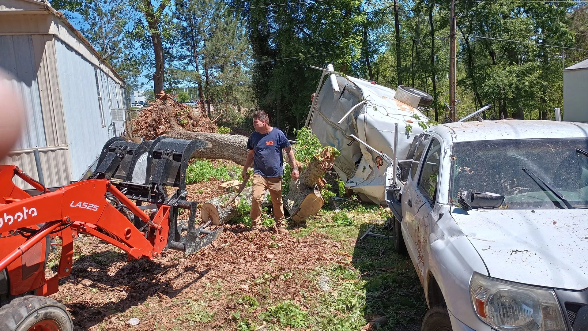 Kubota grapple crushed white truck mobile home storm cayce