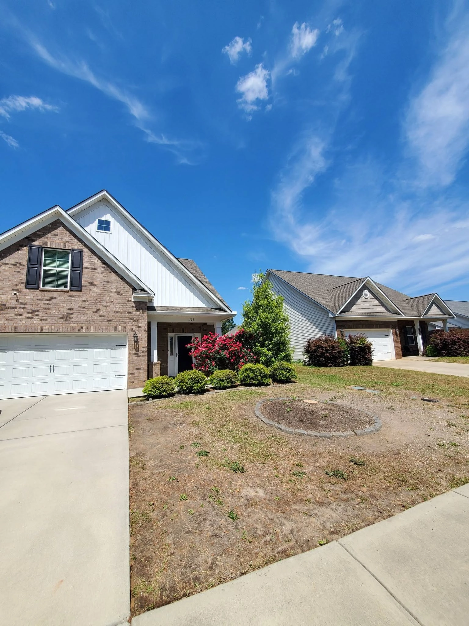 Stone ring empty tree bed front lawn cayce sc