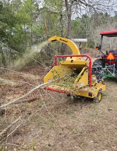 Vermeer wood chipper feeding brush tractor cayce sc